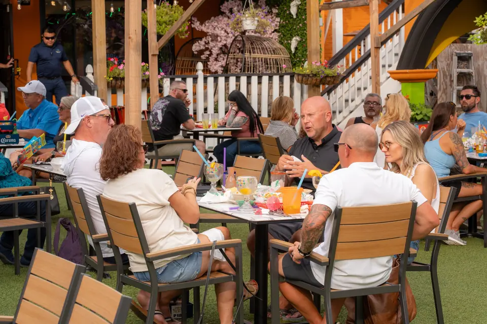 Full tables on the lawn terrace