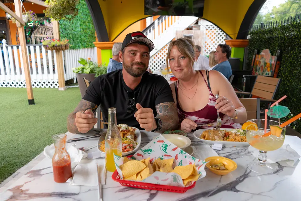 Guests smiling at their table