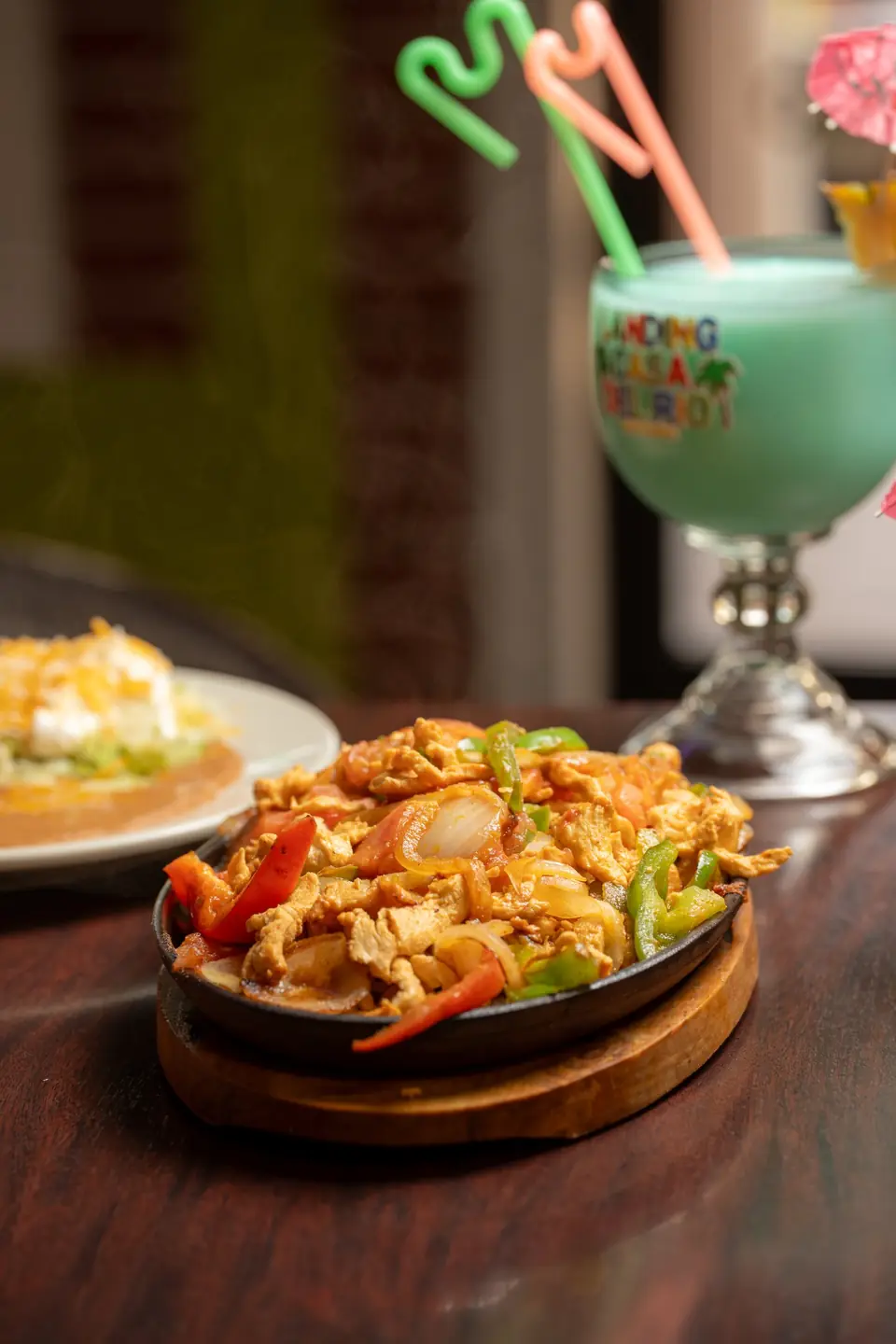 Chicken fajitas on a sizzling board