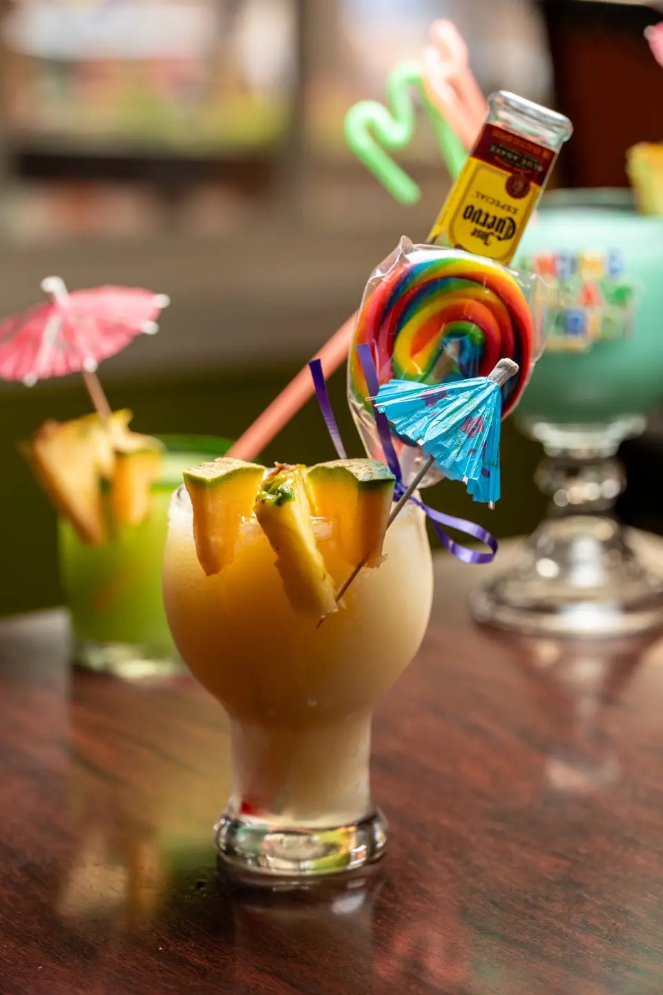 Frozen drink with a lollipop and a Corona