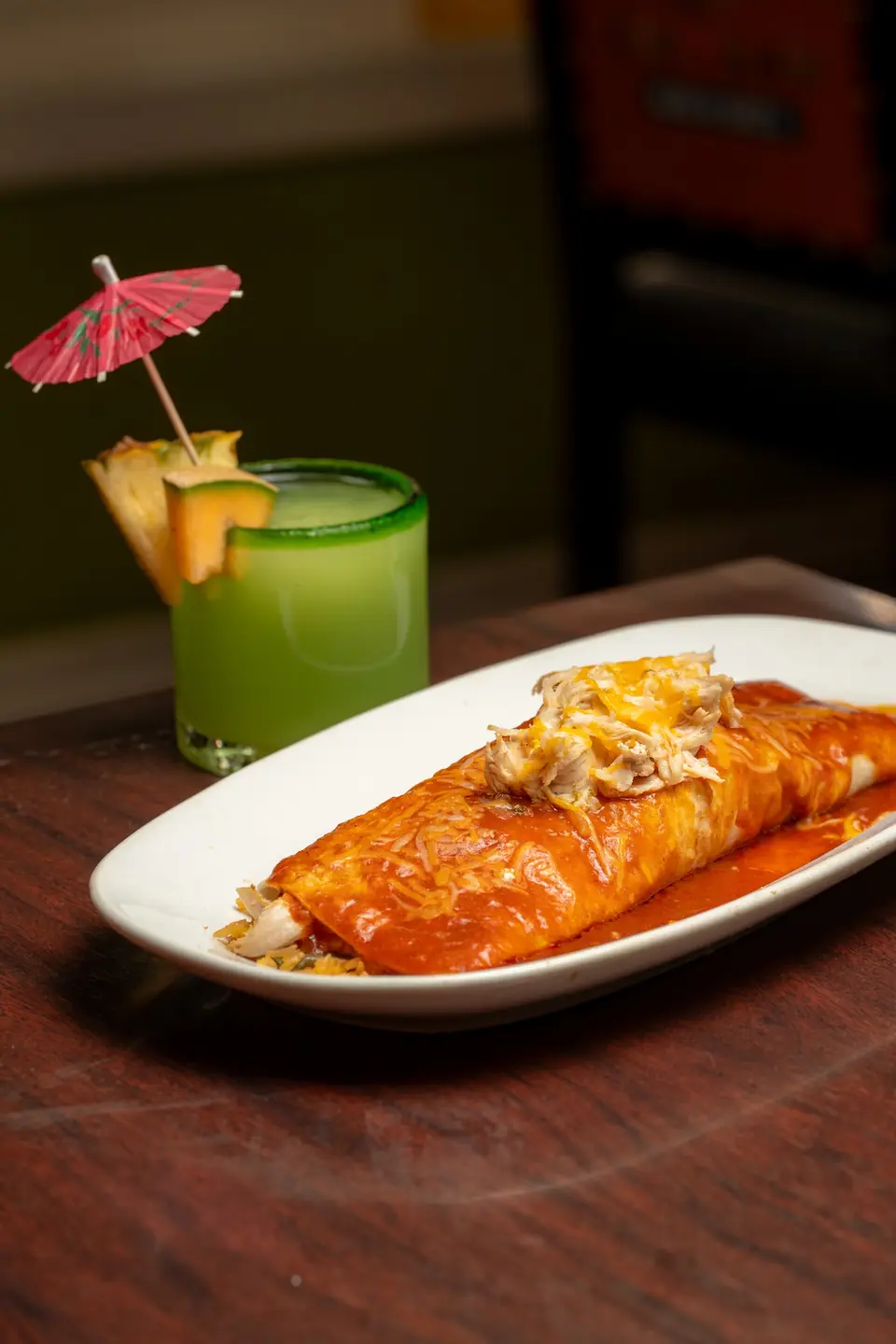 Smothered burrito with a green drink